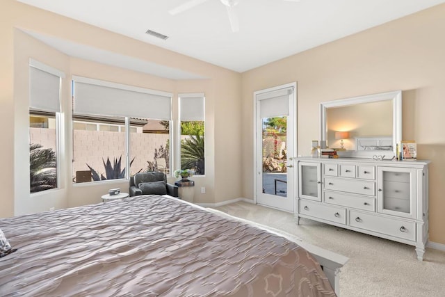 bedroom featuring access to outside, light carpet, and ceiling fan