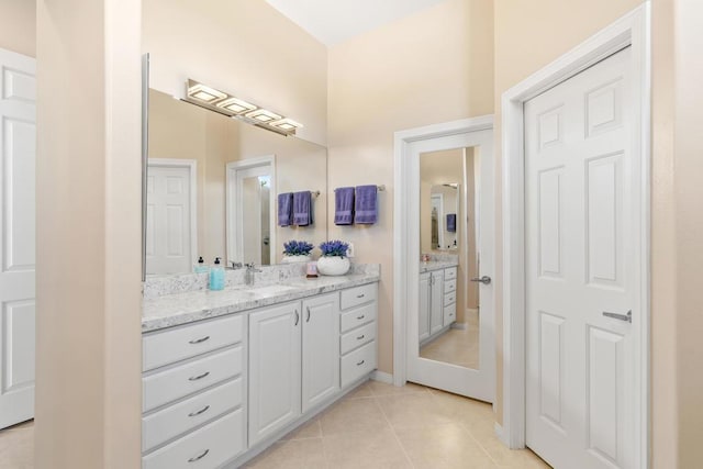 bathroom featuring tile patterned flooring and vanity