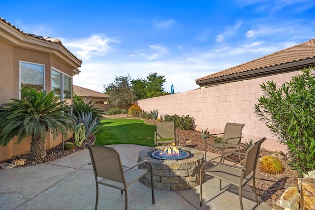 view of patio / terrace featuring an outdoor fire pit