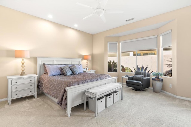 bedroom featuring ceiling fan and light carpet