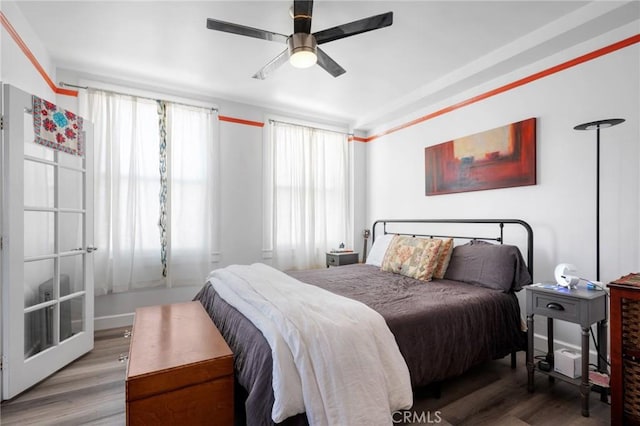 bedroom featuring hardwood / wood-style flooring and ceiling fan