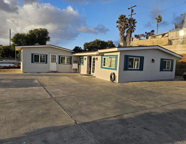 single story home featuring a patio