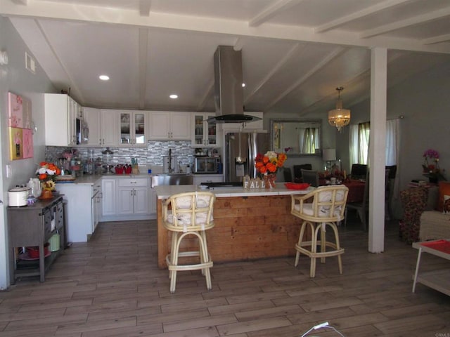 living room featuring light wood-type flooring, lofted ceiling with beams, and a notable chandelier