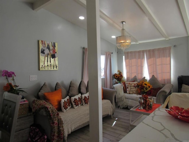 living room featuring hardwood / wood-style floors, vaulted ceiling with beams, and a notable chandelier