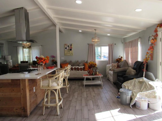 interior space with lofted ceiling with beams, light hardwood / wood-style floors, and a notable chandelier