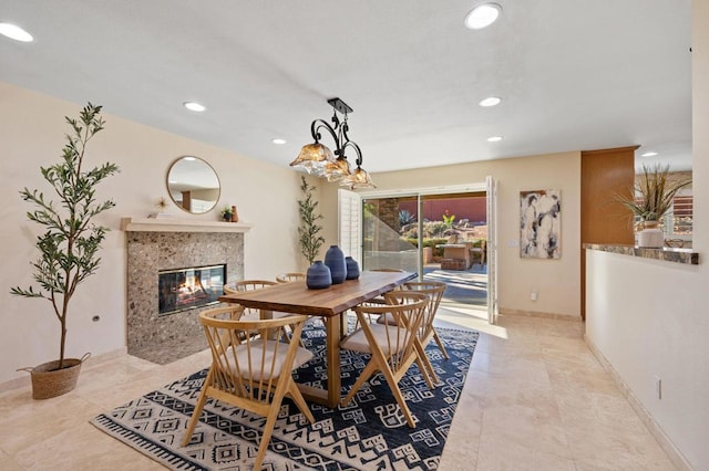 dining area with a premium fireplace