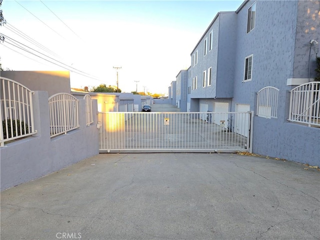 view of gate with a garage