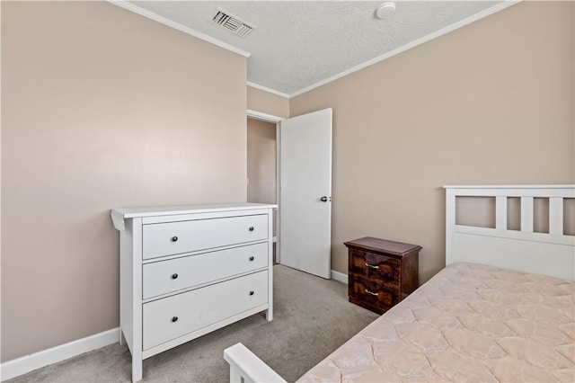 bedroom featuring crown molding, a textured ceiling, and light carpet