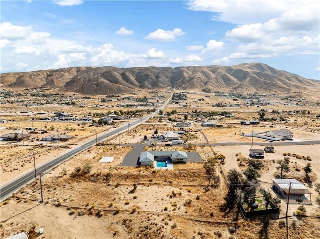 birds eye view of property with a mountain view