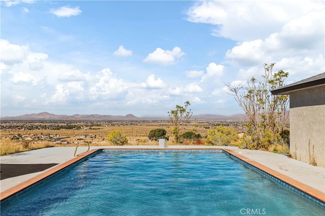 view of pool with a mountain view