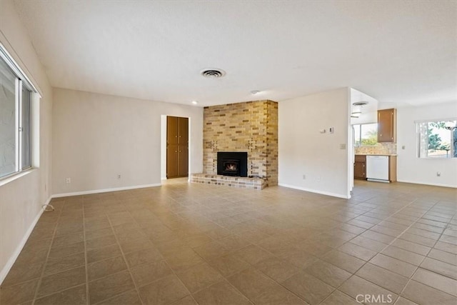 unfurnished living room featuring tile patterned flooring