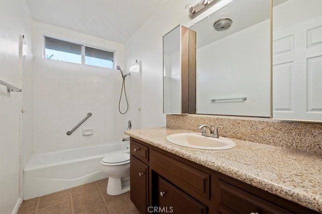 full bathroom featuring washtub / shower combination, tile patterned floors, vanity, and toilet