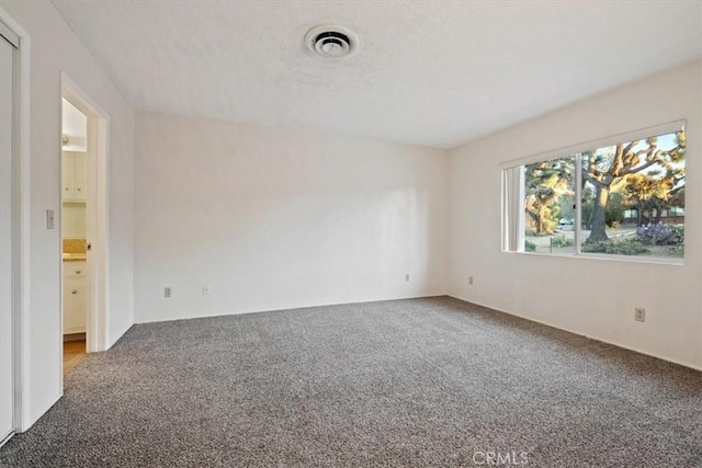 unfurnished room featuring carpet floors