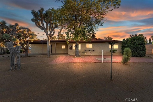 ranch-style house featuring a patio