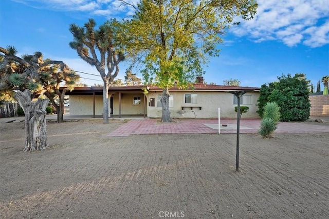 single story home featuring a patio