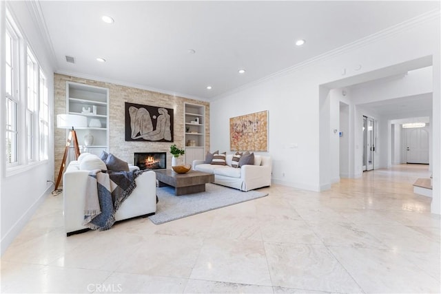 living room with a fireplace, built in features, and ornamental molding