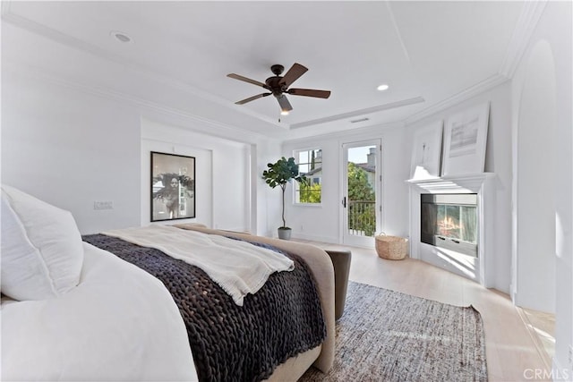 bedroom with ceiling fan and ornamental molding