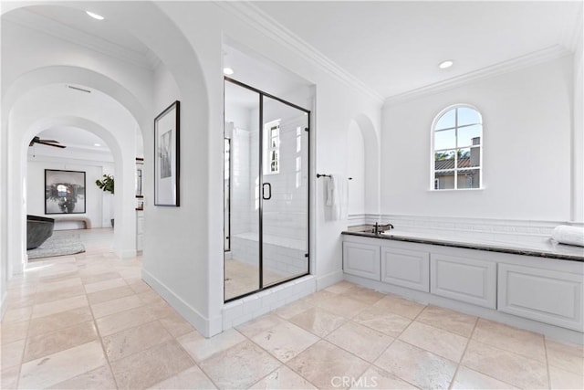 bathroom with crown molding and an enclosed shower