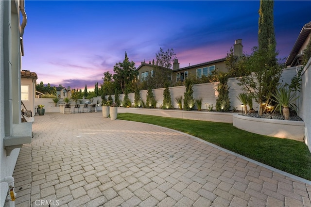 patio terrace at dusk with an outdoor bar