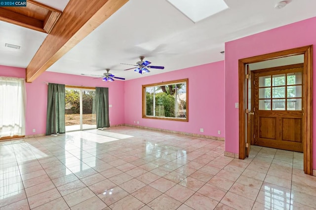 interior space with beamed ceiling, ceiling fan, and light tile patterned flooring