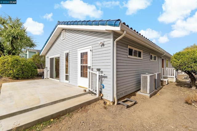 view of side of home featuring a patio