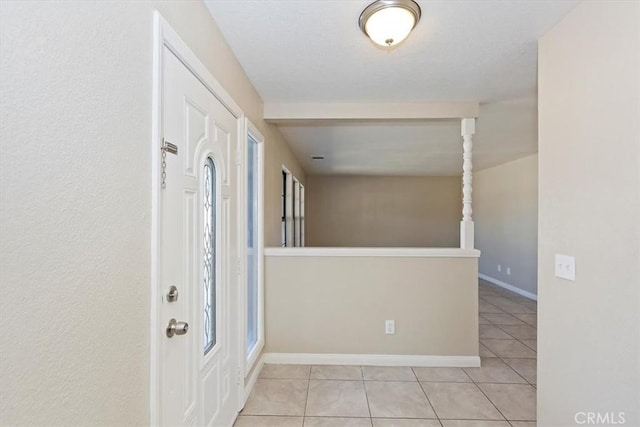 foyer featuring light tile patterned floors