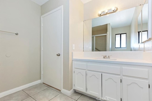 bathroom with tile patterned floors, vanity, and a shower with shower door