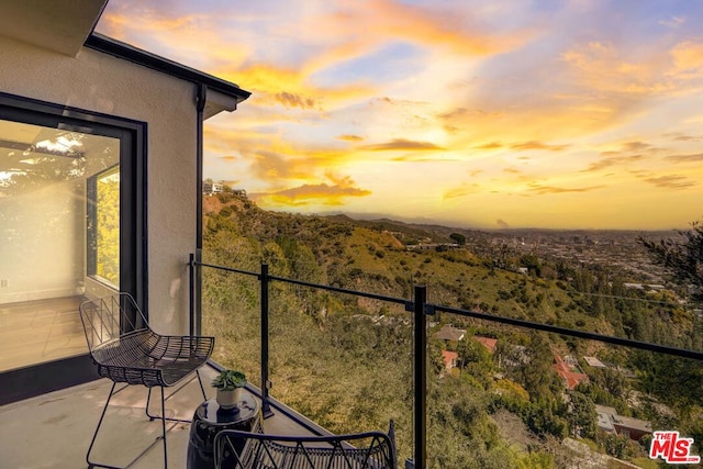 view of balcony at dusk