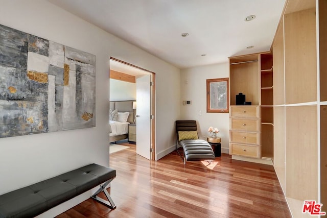 sitting room with hardwood / wood-style flooring