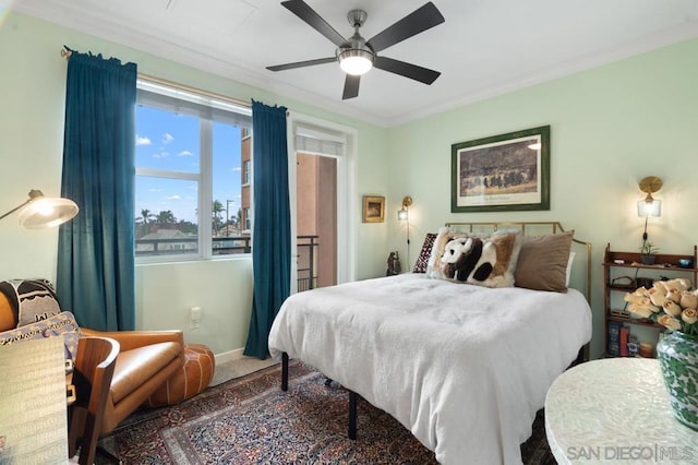 bedroom featuring crown molding, ceiling fan, and carpet flooring