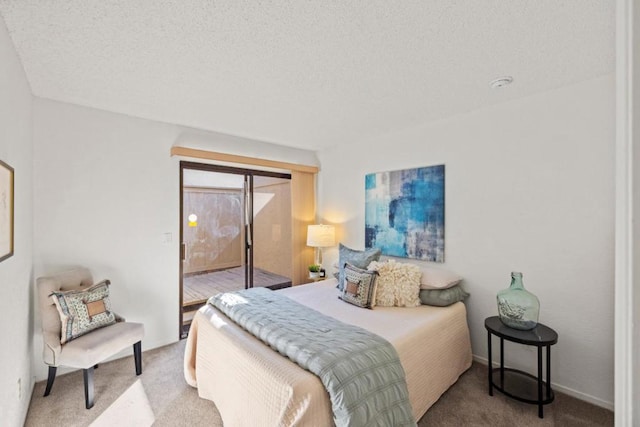 carpeted bedroom with a textured ceiling