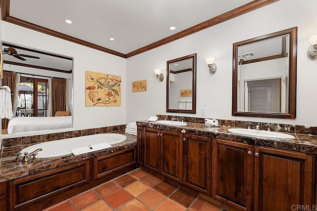 bathroom with crown molding, a tub to relax in, vanity, and ceiling fan