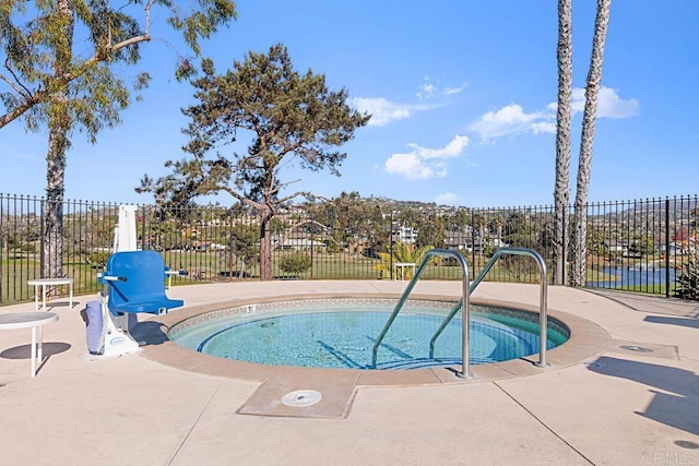 view of swimming pool with a patio