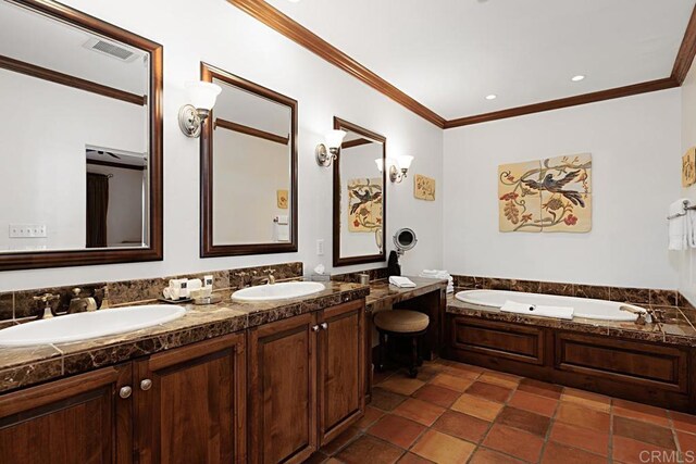 bathroom featuring vanity, ornamental molding, and a washtub