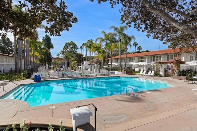 view of swimming pool with a patio area