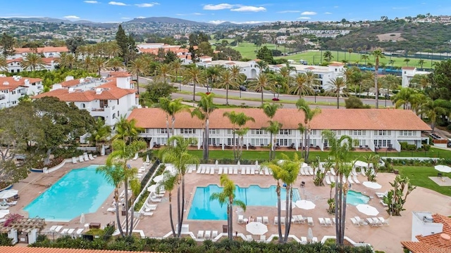 birds eye view of property with a mountain view