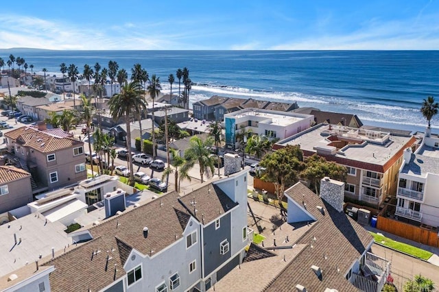 aerial view with a water view and a beach view