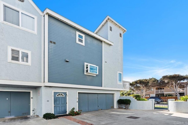 multi unit property featuring a garage