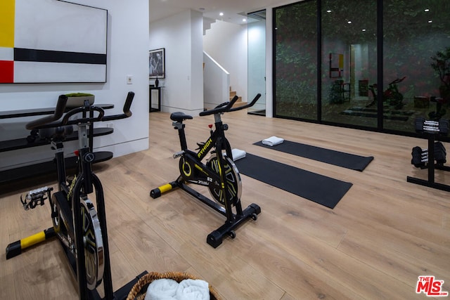 exercise area with hardwood / wood-style flooring