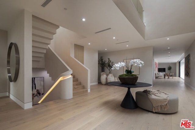 interior space with light hardwood / wood-style floors and a wealth of natural light