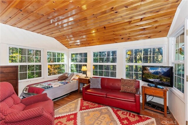 sunroom with vaulted ceiling, plenty of natural light, and wood ceiling