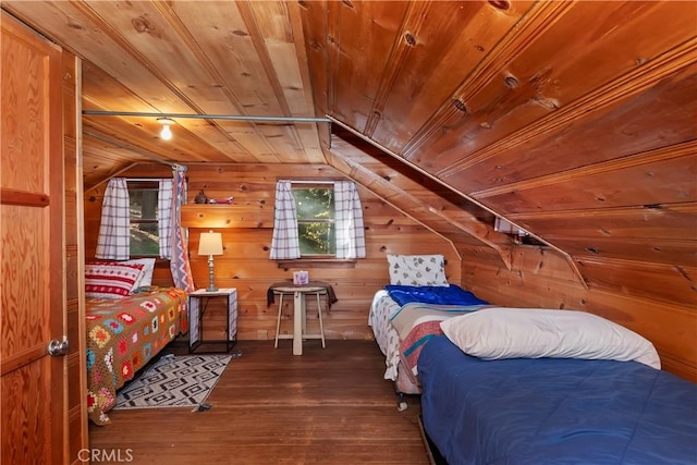 bedroom featuring wooden walls, dark hardwood / wood-style flooring, wood ceiling, and vaulted ceiling