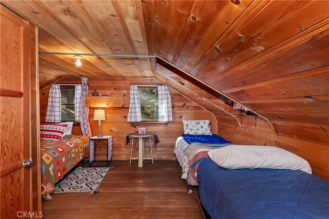 bedroom with wood walls, dark hardwood / wood-style flooring, vaulted ceiling, and wooden ceiling