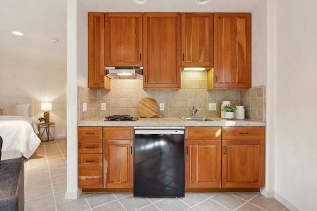 kitchen with sink, light tile patterned floors, dishwasher, tasteful backsplash, and gas stovetop