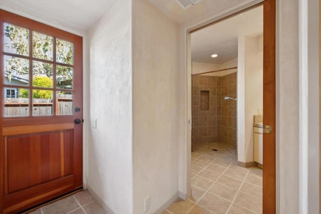 doorway featuring light tile patterned floors