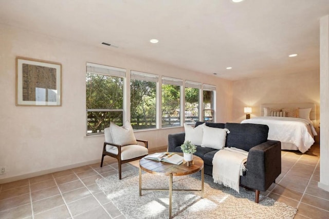 bedroom with light tile patterned floors