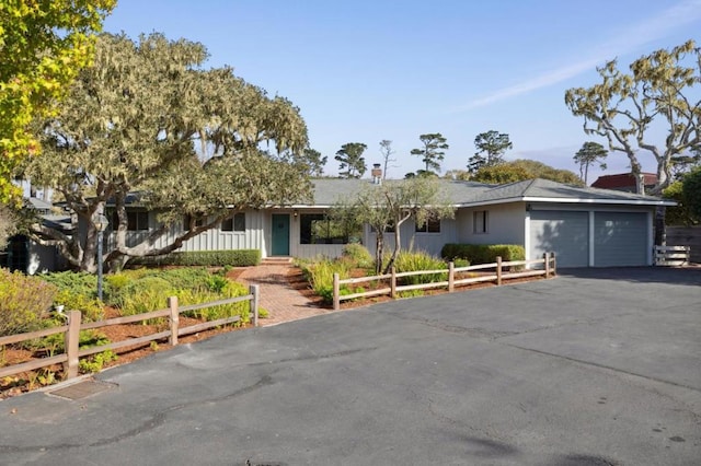 single story home with a garage