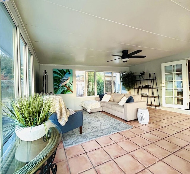 sunroom / solarium featuring ceiling fan