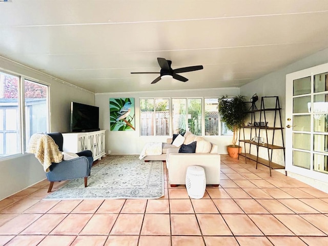 sunroom featuring plenty of natural light and ceiling fan