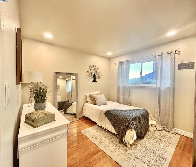 bedroom featuring hardwood / wood-style floors